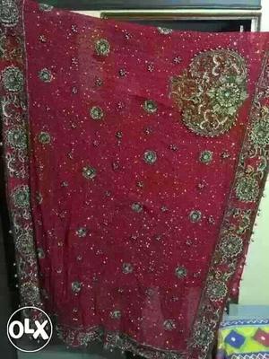 A red color bridal party wear lehnga