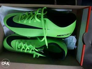 Pair Of Green-and-black Nike Cleats In Box