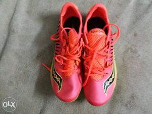 Pink-and-black Cleats