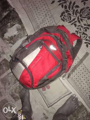 Red, Gray, And Black Backpack