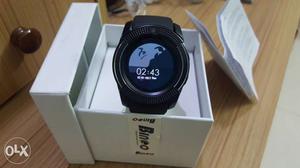 Round Black Smart Watch With Black Sports Band In Case