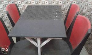 Two sets of iron and marble plated tables and 8