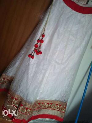 A white and decent red color lehnga, with a heavy