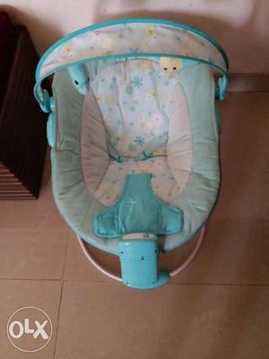 Baby's Blue And White Floral Bouncer Seat