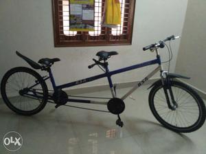 Blue And White Tandem Bicycle