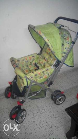 Blue and green baby pram1 year old