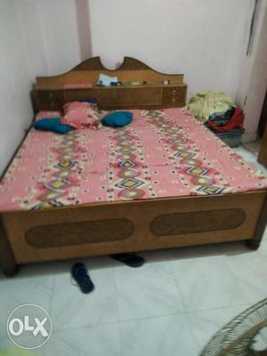 Brown And Beige Wooden Panel Bed