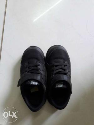 Children's Pair Of Black Nike Shoes