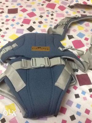 First step new baby carrier with a single strap -