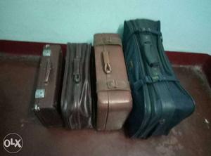 Four Black And Brown Leather Soft Shell Luggage