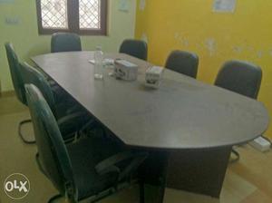 Heavy big conference table along with 8 chairs