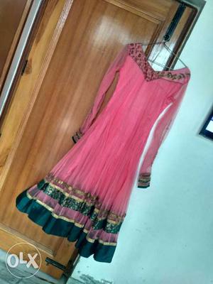 Light pink anarkali, full flair suit. With a