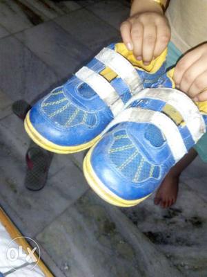 Pair Of Blue-and-white Velcro Strapped Sneakers