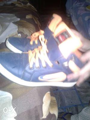 Pair Of Blue-and-yellow High Top Sneakeers