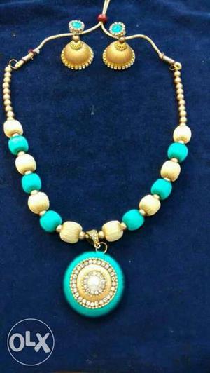 Round Teal-and-gold Silk Threaded Pendant With Bead Link