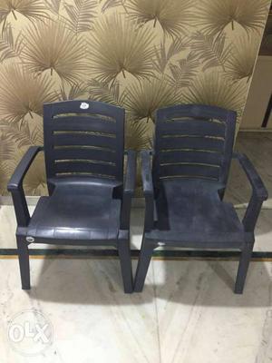 Two Black Plastic Armchairs