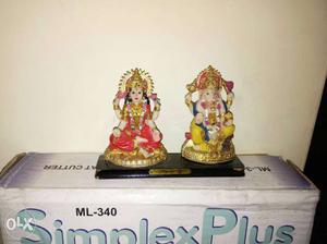 Two White And Gold Ceramic Religious Figurines