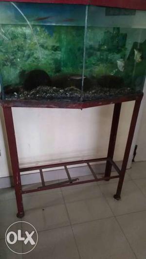 Aquarium with stand. Cover slightly damaged.