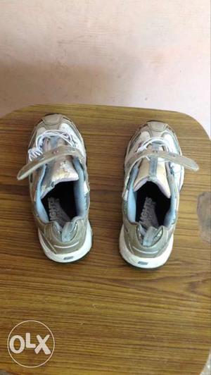 Sports shoes; suited for 7 to 8 years old