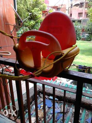 Toddler's Red And Yellow Plastic Swing