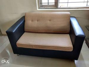 Beige And Black Checked Loveseat