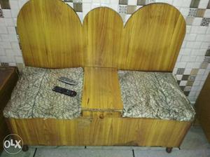 Brown Wooden Bench With Remotes