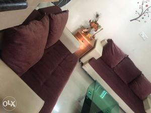 Leather sofa with velvet cushion. One 3 seater