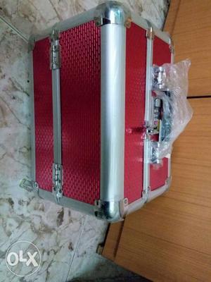 Red And Gray Suit Case