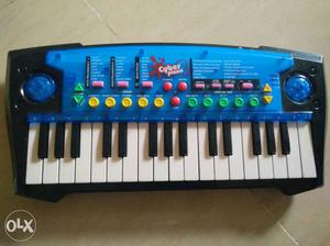 Blue And Black Electronic Keyboard