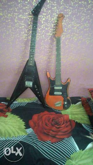 Two Flying V And Stratocaster Electric Guitars