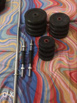 Black And Stainless Steel Barbell Rods And Weightplates