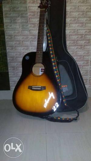Brown And Black Acoustic Guitar With Black Case