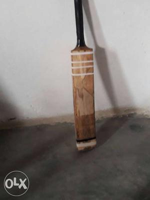 Brown And Black Wooden Cricket Bat
