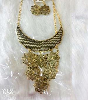 Gold Chain Link Bib Necklace And Pair Of Earrings