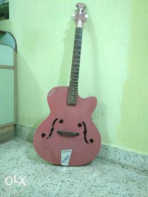 It's a pink color Givson Guitar used only for 3