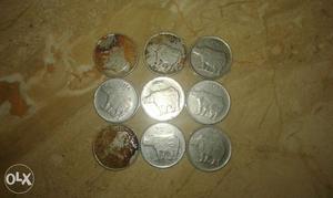 Nine 25 Indian Paise Coins