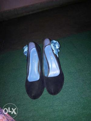 Pair Of Black Almond Toe Leather Heels