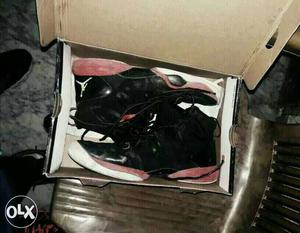 Pair Of Black-and-red Air Jordan Basketball Shoes In Box