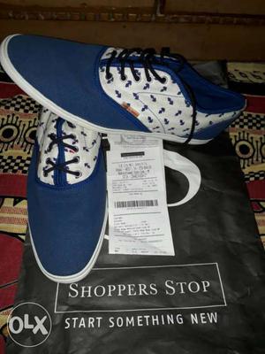 Pair Of Blue-and-white Shoppers Stop Shoes