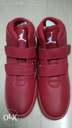 Pair Of Red Leather Air Jordan Basketball Shoes