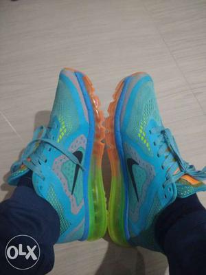 Pair Of Teal-and-orange Nike Mesh Running Shoes