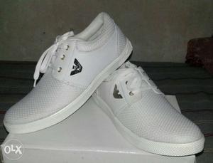 Pair Of White Low Top Sneakers On Box