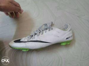 Paired Green, Black, And White Nike Mercurial
