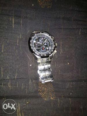 Round Black And Silver Chronograph Watch