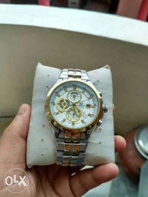 Round Gold Case Chronograph Watch With Silver And Gold