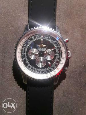 Round Silver Breitling Chronograph Watch With Black Leather