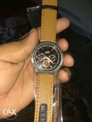 Round Silver Chronograph Watch With Brown Leather Bracelet