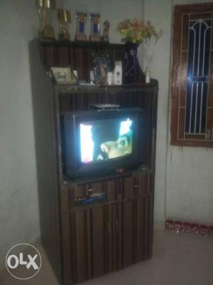 Brown Wooden TV Hutch With Gray CRT TV