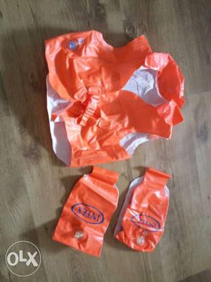 Orange And White Safety Vest and swimming floaters