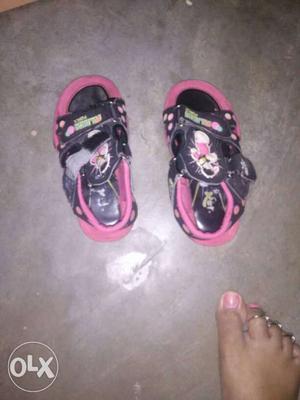 Pair Of Black-and-pink Velcro Strap Flat Sandals